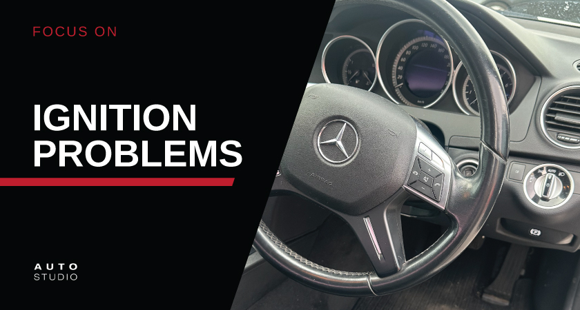 Image with white text 'Ignition Problems' on a black background next to a photo of a Mercedes steering wheel.