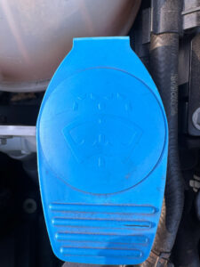 Photo of a washer fluid cap from a Volkswagen.