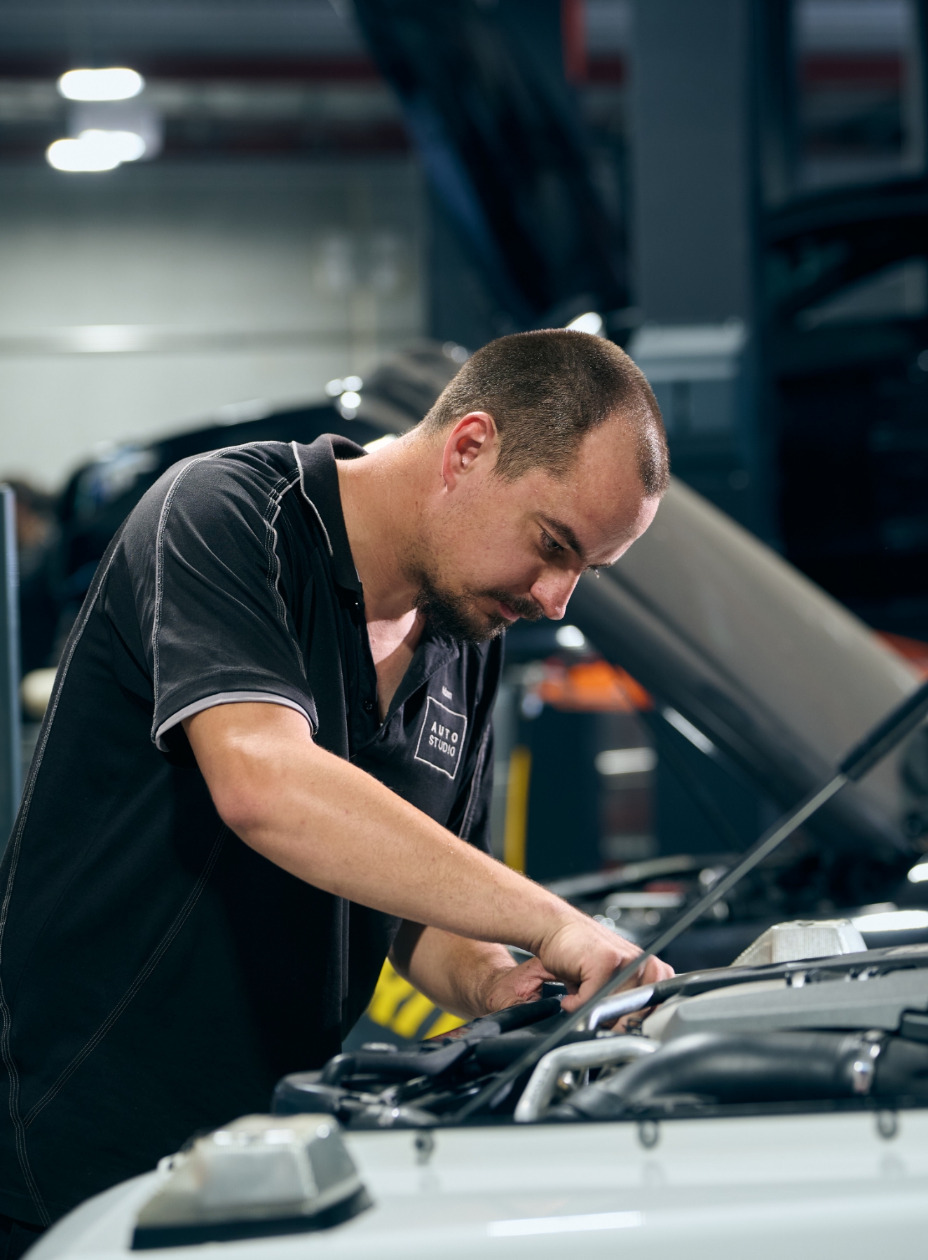 An Auto Studio expert European car mechanic working on a vehicle